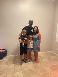 a family posing for a picture in a living room