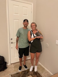 a man and woman standing in front of a door